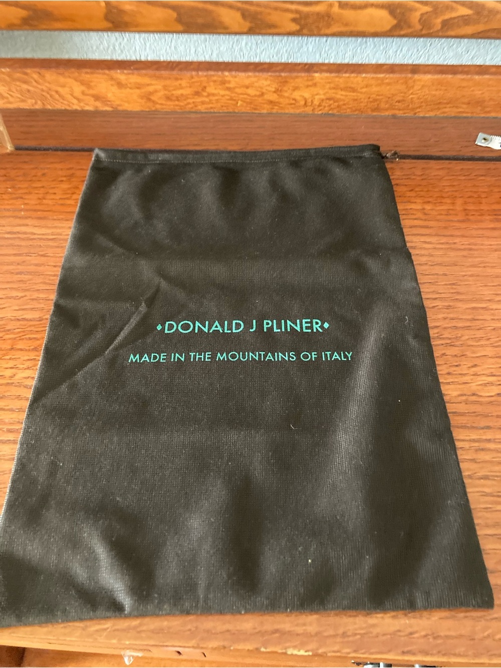 Donald J Pliner 10.25” x 14.5” dust bag made in the mountains of Italy